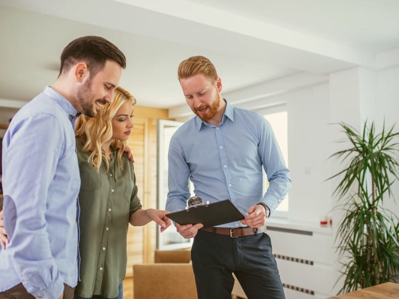 young couple getting a in-home flooring estimate