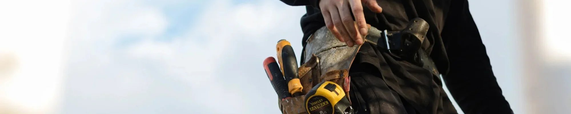 Professional installer carrying his tool belt